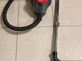 a vacuum that is sitting on the floor next to the floor
