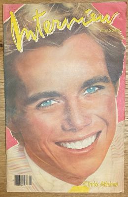 the front cover of a magazine with a smiling man on it