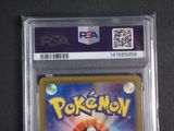 the pokemon card is in a plastic holder on a black surface