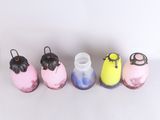 five different colored glass bottles lined up next to each other