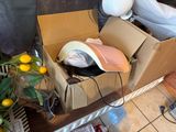 a cardboard box with a hat in it sitting on a table