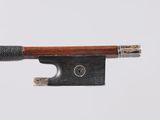 a close up of a violin bow on a white background