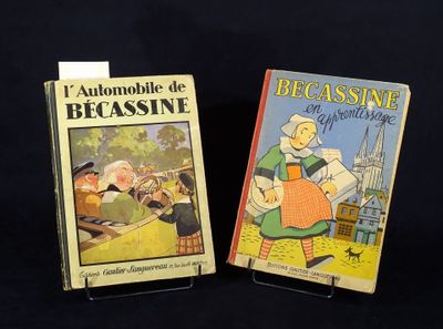 Deux livres pour enfants sont posés sur une surface noire