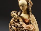 a statue of a woman holding a child in her arms
