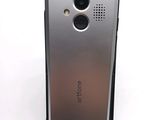 a close up of a cell phone on a white surface