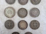 a close up of a bunch of coins sitting on top of a table