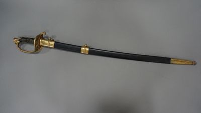 an image of a sword that is on a table