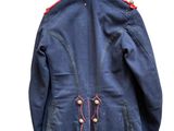 an image of a blue jacket with red trims on a hanger