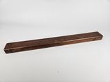 a wooden shelf with a long piece of wood sticking out of it