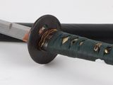 a close up of a knife on a white surface