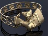 une image représentant un bracelet en or orné d'un oiseau