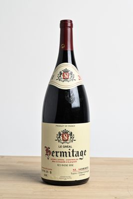 a bottle of wine that is sitting on a table