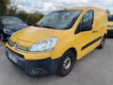 yellow citrole van parked in a parking lot next to other cars