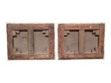 pair of antique wooden window shutters with glass inserts