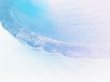 a close up picture of a bowl with a toothbrush in it