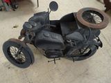 an old motorcycle that is sitting on the floor
