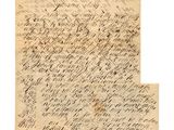 une lettre écrite en cursive sur une feuille de papier