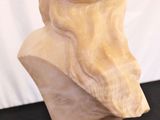 marble bust of a man wearing a turban on a black table
