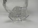 a clear glass vase with a hexagonal design on it
