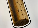 a picture of a hanging light made of wood