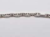 a close up of a silver chain bracelet with a clasp