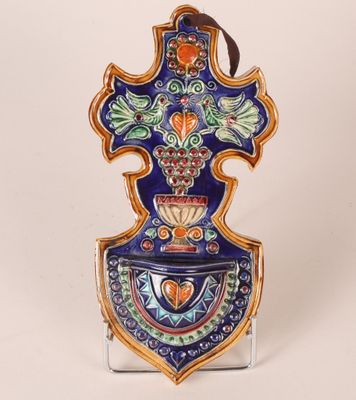 an image of a decorative vase with a cross on it