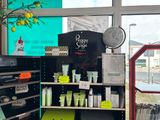 a display of beauty products in a store near a window