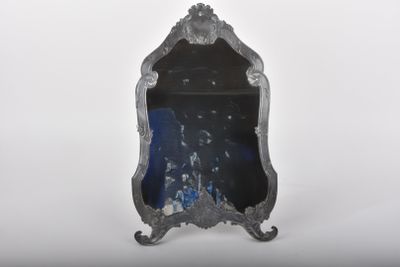 a mirror that is sitting on top of a table