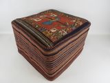 an image of a small ottoman made out of a blanket