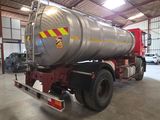 a large tanker truck parked inside of a building