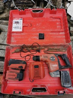 a red tool box with tools in it on the ground
