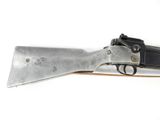 a close up of a gun on a white surface with a white background
