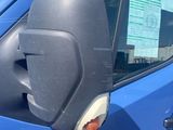 a blue van with a sticker on the side of it