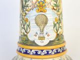 a vase with a hot air balloon painted on it