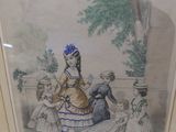 framed picture of a woman in a dress with a group of children