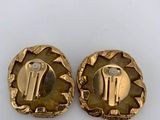 a pair of gold plated buttons with a man and a woman on them