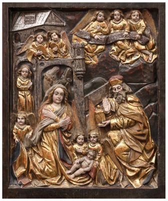 a gold relief of the nativity of jesus and his family