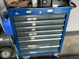 a blue tool cart with a lot of tools on it