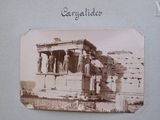 a picture of an old photo of some people in front of a building