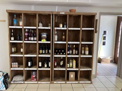 many bottles of wine on the shelves in the room