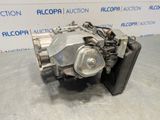 a picture of a car engine that is sitting on top of a table