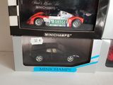 two model cars in the box on the table