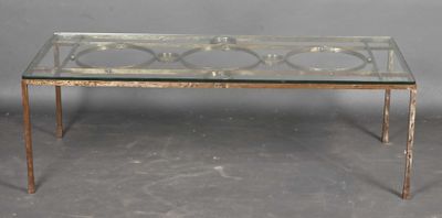 a glass table with a metal frame and a glass top