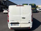 a white van that is parked in a parking lot