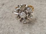 a diamond ring on the ground with a diamond in it
