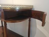 a wooden table with a metal tray on top of it
