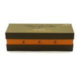 an orange and black gift box with a deer design on it