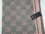 a close up of a scarf with a tag on it