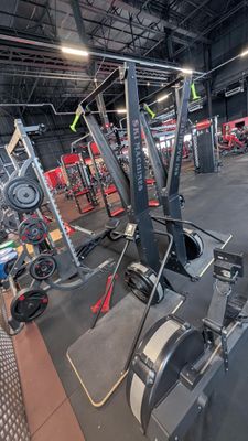 a view of a gym with a row of machines in it