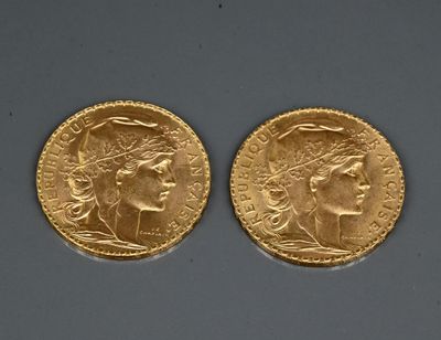 two gold sovereigns, one with a head of a woman and the other with a head of a man